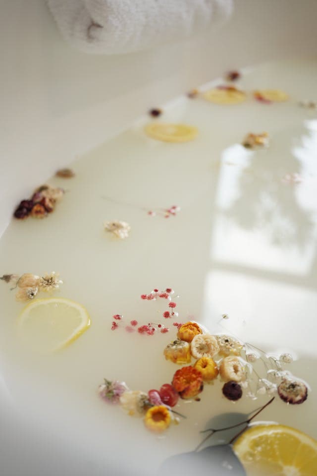 milky aroma bath with fruits and herbs in it