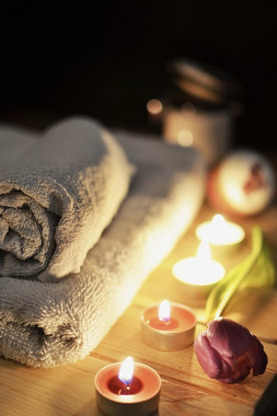 towels and candles on a table